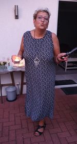 Woman looking away while standing on table