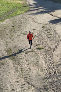 High angle view of man running on road