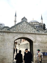 People in front of historical building