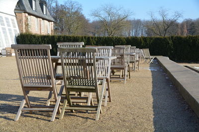 Chairs on grass against trees