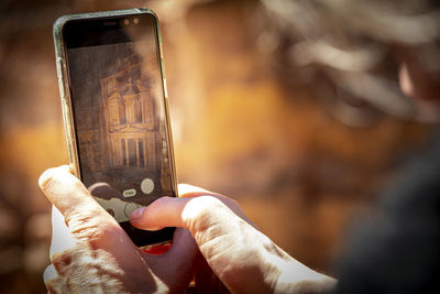 Close-up of person using mobile phone