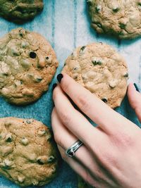 Close-up of woman hand holding cookies