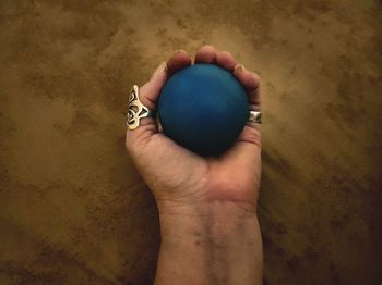 Close-up of man holding heart shape