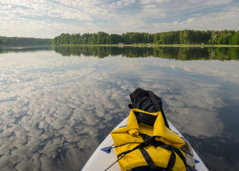 Low section of man in boat in lake