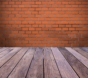 Old vintage brick wall background and outdoor wood floor with rusted screw texture.