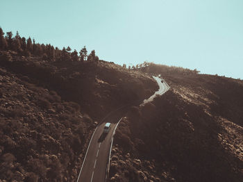 Panoramic view of mountain road against clear sky