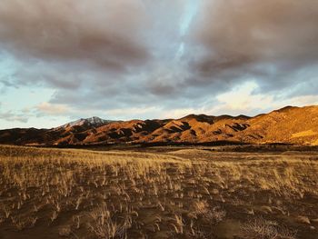 Scenic view of landscape and mountains against sky