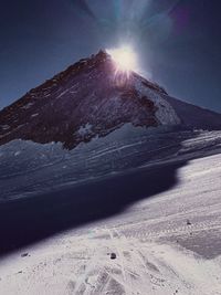 Scenic view of snow covered mountains against sky