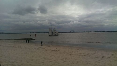 Scenic view of sea against cloudy sky