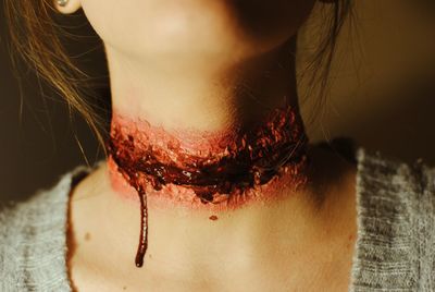 Close-up of wounded woman neck