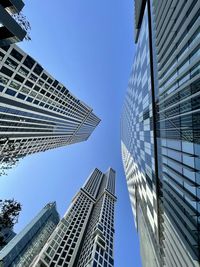 Low angle view of modern buildings against clear sky