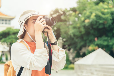 Midsection of woman photographing