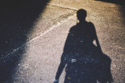 Shadow of people on footpath