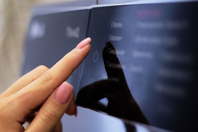 Close-up of person holding mobile phone