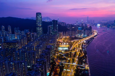 Aerial view of illuminated buildings in city at night