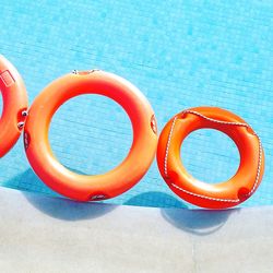 High angle view of life belts floating on swimming pool