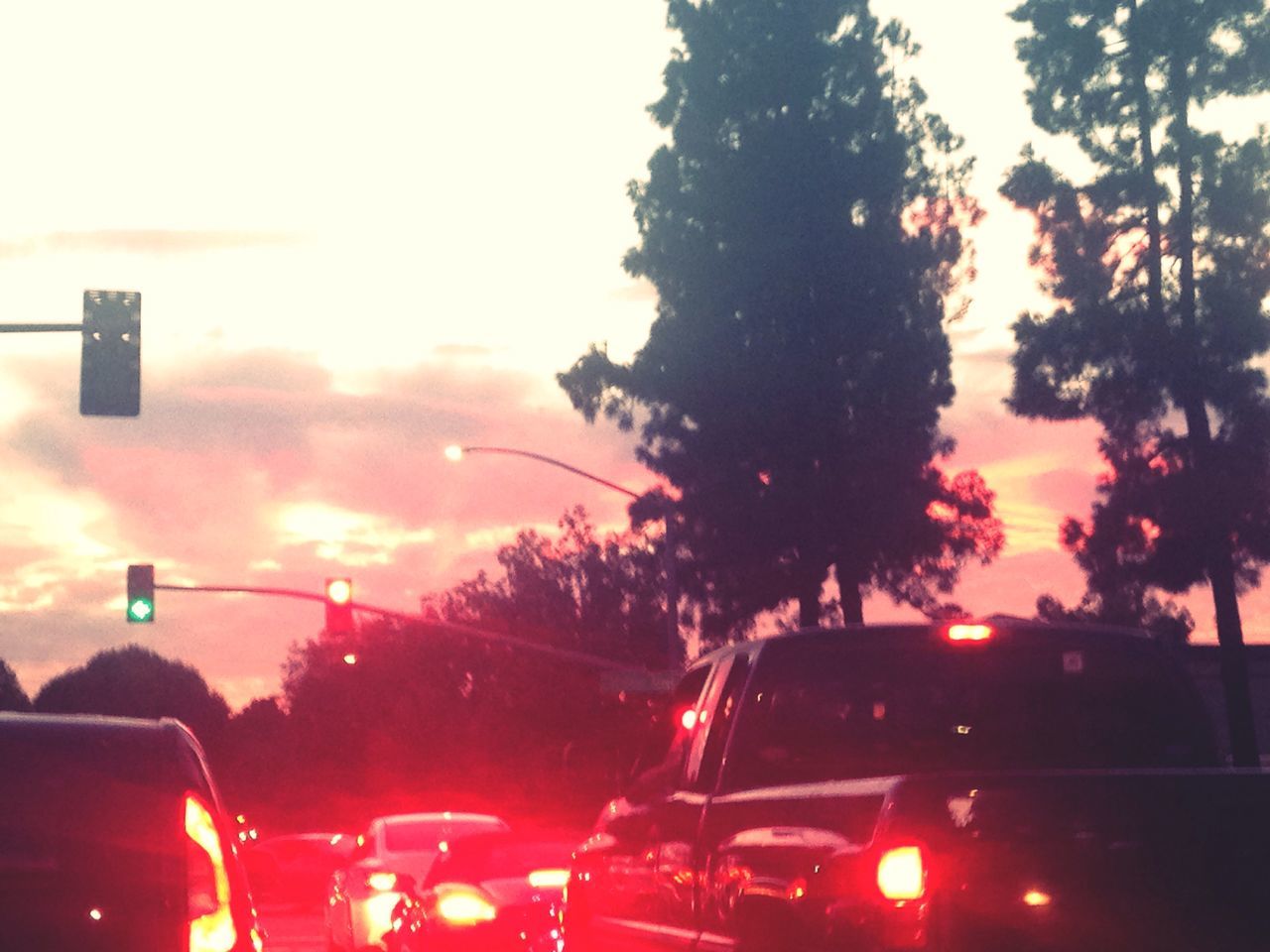 SILHOUETTE OF CARS ON ROAD