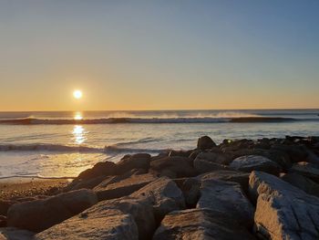 Scenic view of sea against sky during sunset