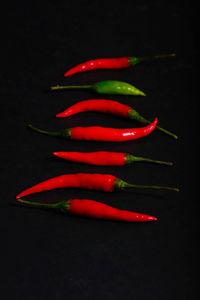 Close-up of red chili pepper against black background