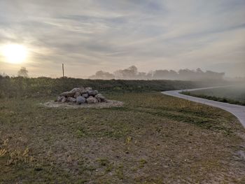 Scenic view of field against sky during sunset