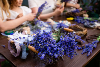 Group of people on purple flowering plants