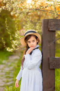 Side view of girl wearing summer hat