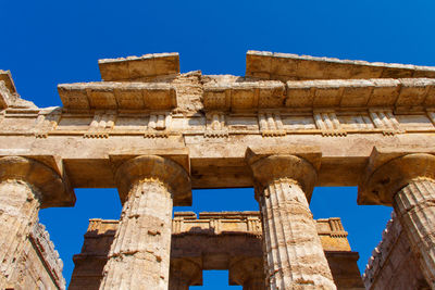 Low angle view of old ruins against clear sky