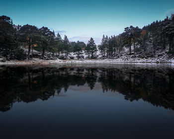 Scenic view of lake against clear blue sky