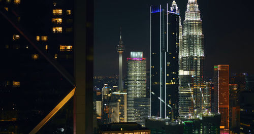 Illuminated modern buildings in city against sky at night ,kuala lumpur ,malaysia