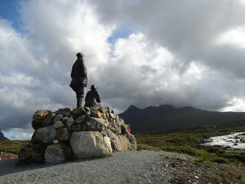 Rocks standing on rock against sky