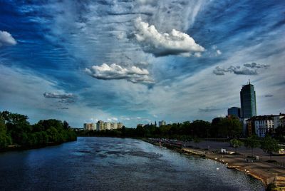 Buildings against cloudy sky