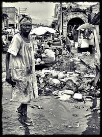 Portrait of man standing in city