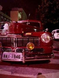 Vintage car on street at night