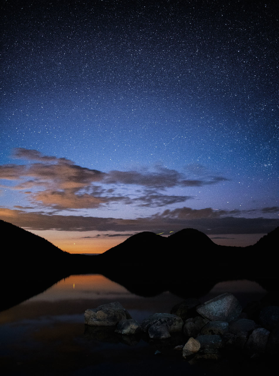 sky, scenics - nature, tranquility, beauty in nature, tranquil scene, star - space, no people, mountain, space, water, astronomy, nature, night, idyllic, non-urban scene, environment, landscape, rock, silhouette