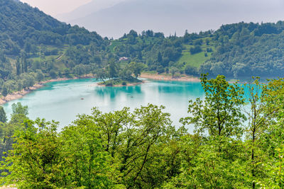 Scenic view of lake and trees against sky