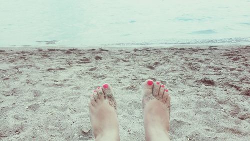 Low section of woman on beach