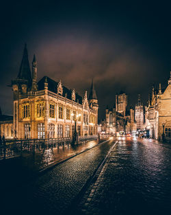 Buildings in city at night