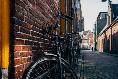 Old bicycle on cobblestone street in netherlands