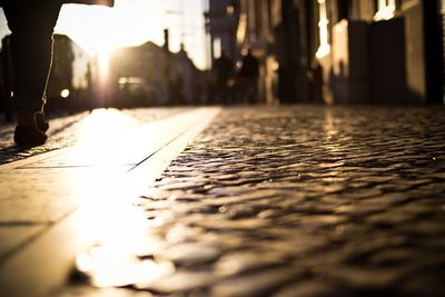 Low section of man on illuminated street