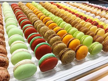 High angle view of colorful macaroons for sale at market