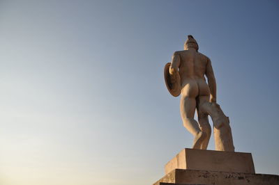 Low angle view of statue against sky