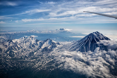 Scenic view of snowcapped mountains against sky