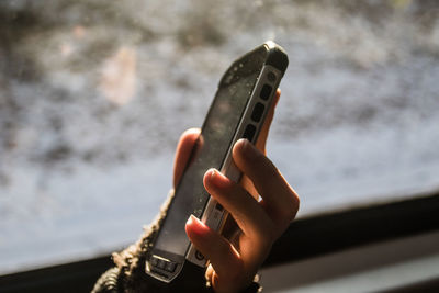 Close-up of hand using mobile phone