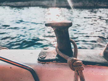 Close-up of rope tied on metal