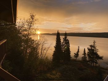 Scenic view of lake against sky during sunset