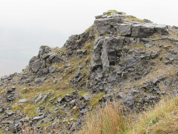 Rock formations on landscape against sky