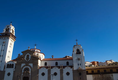 Low angle view of building against clear blue sky