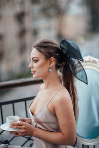 Young woman drinking coffee cup