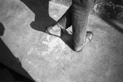 Low section of man standing on floor