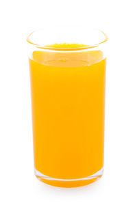 Close-up of yellow drink against white background
